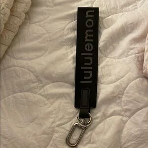 black lululemon never lost keychain